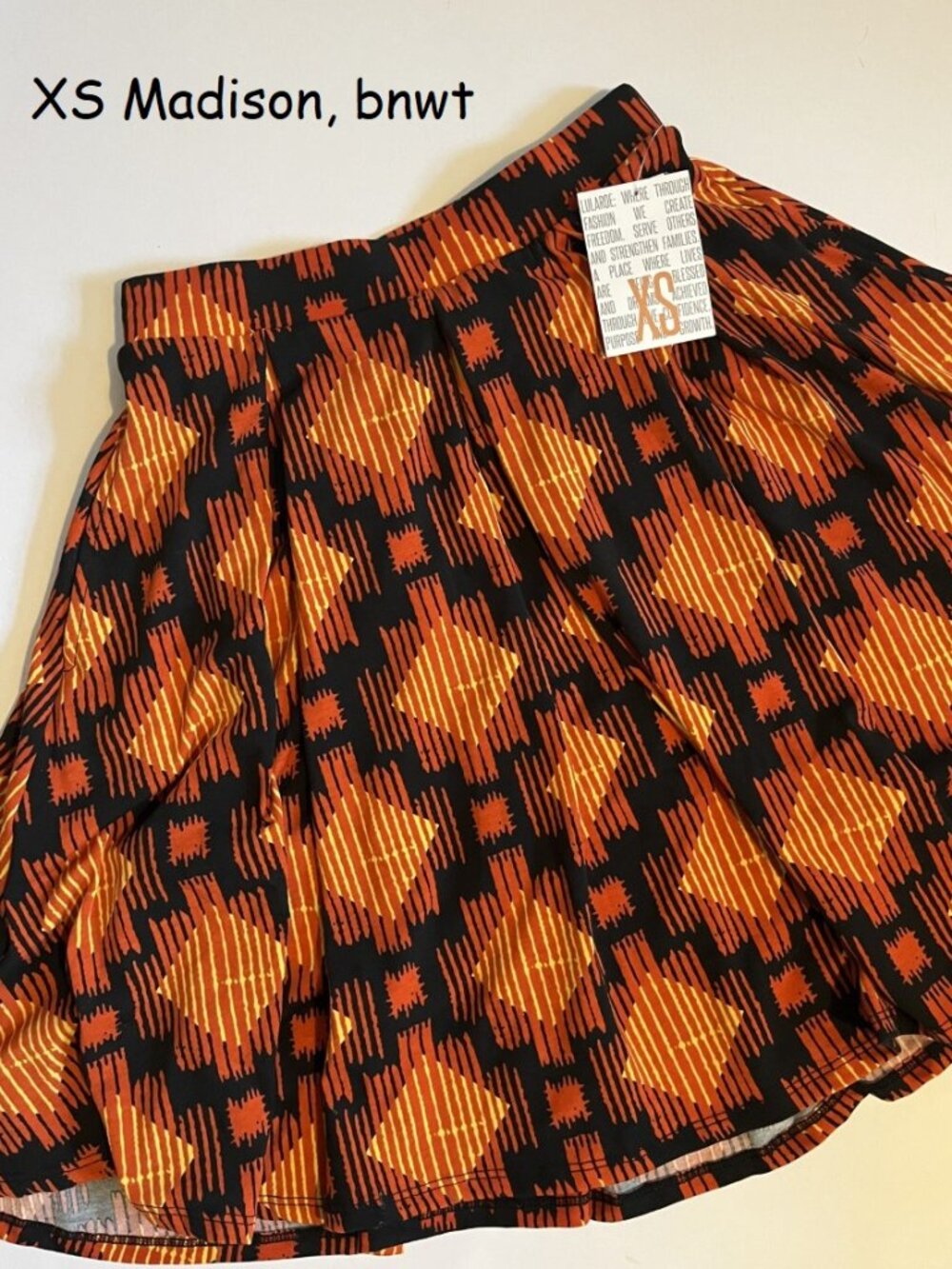 XS Lularoe Madison pleated skirt, black with orange diamonds